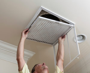 man changing air filter